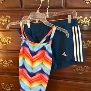 Speedo swimsuit with matching Adidas shorts.
